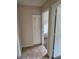 Hallway with tile floors, closet, and bedroom entrance at 4 Spring Trl, Ocala, FL 34472