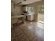 Functional kitchen area with tile flooring and backyard access at 4 Spring Trl, Ocala, FL 34472