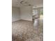 Open living room with tile floors adjacent to the kitchen area at 4 Spring Trl, Ocala, FL 34472