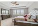 Spacious primary bedroom with large windows and plush bedding at 5172 Nw 46Th Lane Rd, Ocala, FL 34482
