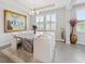 Elegant dining room with marble table and white chairs at 5172 Nw 46Th Lane Rd, Ocala, FL 34482