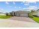 Beautiful two-car garage home with landscaped front yard at 5172 Nw 46Th Lane Rd, Ocala, FL 34482
