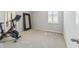 Home gym with Peloton bike and large mirror at 5172 Nw 46Th Lane Rd, Ocala, FL 34482