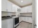 Laundry room with white cabinets, granite countertops and new washer/dryer at 5172 Nw 46Th Lane Rd, Ocala, FL 34482