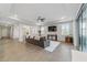 Open living room with tile floors and sliding glass doors at 5172 Nw 46Th Lane Rd, Ocala, FL 34482