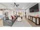 Bright living room featuring a sectional sofa and large TV at 5172 Nw 46Th Lane Rd, Ocala, FL 34482