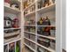 Well-organized pantry with ample shelving and storage baskets at 5172 Nw 46Th Lane Rd, Ocala, FL 34482