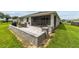 Large patio with built-in seating and grill at 5172 Nw 46Th Lane Rd, Ocala, FL 34482