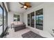 Covered patio with seating area and outdoor fan at 5172 Nw 46Th Lane Rd, Ocala, FL 34482