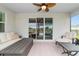 Relaxing screened porch with seating and ceiling fan at 5172 Nw 46Th Lane Rd, Ocala, FL 34482