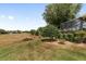 Spacious backyard features mature trees, landscaping, and screened-in patio area at 8463 Sw 84Th Loop, Ocala, FL 34481