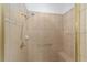 Well-lit bathroom features a tiled shower with built in bench and adjustable shower head at 8463 Sw 84Th Loop, Ocala, FL 34481