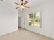 Bright room with ceiling fan and tile flooring at 8463 Sw 84Th Loop, Ocala, FL 34481