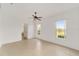 Spacious bedroom with tile floors, ceiling fan, and two windows at 8463 Sw 84Th Loop, Ocala, FL 34481