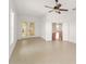 Bright room with tile flooring, ceiling fan, and French doors to outdoor living space at 8463 Sw 84Th Loop, Ocala, FL 34481