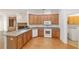 Well-lit kitchen with modern appliances, ample cabinetry, and convenient laundry access at 8463 Sw 84Th Loop, Ocala, FL 34481