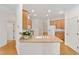 Bright kitchen featuring wood cabinets and granite countertops at 8463 Sw 84Th Loop, Ocala, FL 34481