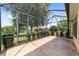 Covered patio area with screened-in enclosure offers an outdoor living space at 8463 Sw 84Th Loop, Ocala, FL 34481
