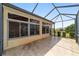 Spacious outdoor patio with screened enclosure providing a shaded retreat and a view of the surrounding neighborhood at 8463 Sw 84Th Loop, Ocala, FL 34481