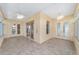 Spacious sunroom with tile floors, ceiling fans, and multiple entry points, ideal for entertaining and indoor-outdoor living at 8463 Sw 84Th Loop, Ocala, FL 34481