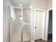 Modern bathroom featuring a glass-enclosed shower with neutral tiling and sleek fixtures at 10107 Sw 41St Ave, Ocala, FL 34476