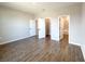 Bright bedroom showing doors to a walk-in closet and bathroom, with wood-look tile flooring at 10107 Sw 41St Ave, Ocala, FL 34473