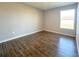 This bedroom features neutral-colored walls, tile flooring, and a window for ample natural light at 10107 Sw 41St Ave, Ocala, FL 34476