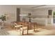 Bright dining room and kitchen combo with modern lighting, seating, and stainless appliances at 10107 Sw 41St Ave, Ocala, FL 34476