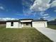 Charming one-story home with a well-maintained lawn and a two-car garage and long concrete driveway at 10107 Sw 41St Ave, Ocala, FL 34476