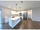 Bright kitchen featuring an island, stainless appliances, and sleek countertops at 10107 Sw 41St Ave, Ocala, FL 34476