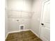 A compact laundry room provides essential utility space, complete with modern hookups and clean finishes at 10107 Sw 41St Ave, Ocala, FL 34476