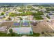 Aerial view of the property's location within a charming community with lush green trees and clear blue skies at 10107 Sw 41St Ave, Ocala, FL 34476