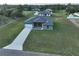 New single-Gathering home with an attached garage and long concrete driveway on a large lot at 10107 Sw 41St Ave, Ocala, FL 34476