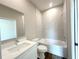 Contemporary bathroom featuring a tub, shower, and modern vanity with sleek fixtures at 10107 Sw 41St Ave, Ocala, FL 34476