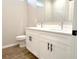 Bathroom featuring double sink vanity, white cabinets, and matte black hardware at 10131 Sw 41St Ave, Ocala, FL 34476