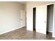 Bedroom with wood-look tile flooring and closet with sliding doors at 10131 Sw 41St Ave, Ocala, FL 34473