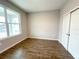 This bedroom offers wood-look flooring, a large window, and a spacious closet at 10131 Sw 41St Ave, Ocala, FL 34476