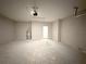Spacious garage featuring concrete flooring, neutral walls and an insulated garage door at 10131 Sw 41St Ave, Ocala, FL 34476