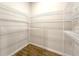 Spacious walk-in closet with ample shelving for organized storage in a neutral palette at 10131 Sw 41St Ave, Ocala, FL 34476