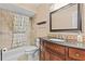 Bathroom featuring a granite countertop, and modern fixtures with a large mirror at 10593 Se 174Th Loop, Summerfield, FL 34491