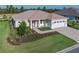 Well-kept single Gathering home shows off its luscious yard, paver driveway and clean design at 9400 Sw 106Th Ave, Ocala, FL 34481