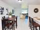 Open-concept living area with dining space, neutral tones, and great natural light at 11 Cedar Trace Crse, Ocala, FL 34472