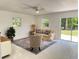 Bright living room with sliding glass doors and neutral décor at 11 Cedar Trace Crse, Ocala, FL 34472