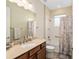 Bathroom featuring a vanity with a sink, toilet, shower, and bath with decorative shower curtain at 8445 Sw 93Rd Cir, Ocala, FL 34481