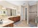 Large bathroom featuring dual sinks and walk-in shower at 8445 Sw 93Rd Cir, Ocala, FL 34481