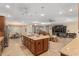 Bright kitchen with a central island, stainless appliances, and an open view to the living area at 8445 Sw 93Rd Cir, Ocala, FL 34481