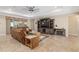 Comfortable living room with a large television, fireplace and sliding glass doors at 8445 Sw 93Rd Cir, Ocala, FL 34481