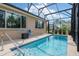 A luxurious private pool surrounded by a screened-in enclosure, perfect for relaxation and entertainment at 8445 Sw 93Rd Cir, Ocala, FL 34481