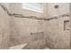 The walk-in shower offers a seat and a handrail and is tiled in neutral tones at 8445 Sw 93Rd Cir, Ocala, FL 34481
