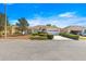 Street view of a well maintained single-story home with an attached garage and manicured landscaping at 9882 Sw 89Th Lane Rd, Ocala, FL 34481